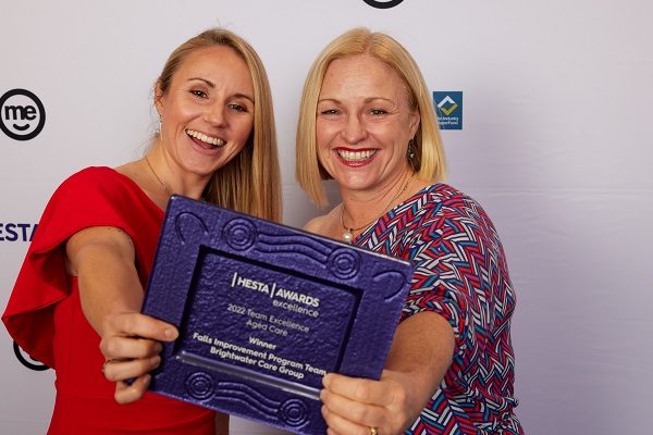 Image of awards winners with trophy