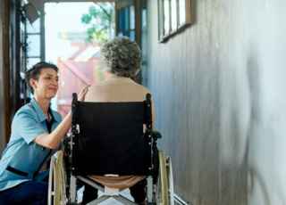 Carer and woman in wheelchair