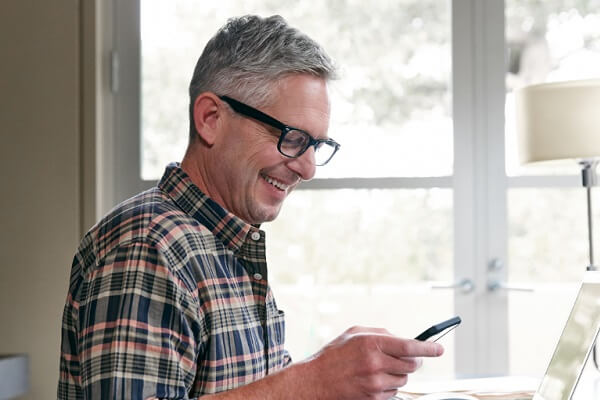 Image of man looking at digital member card