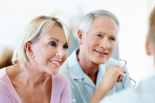 Image of couple speaking to an adviser