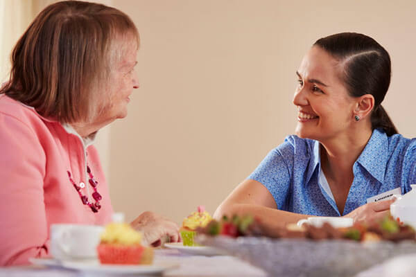 Image of two woman having a conversation