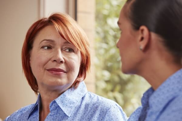 Image of two colleagues at work having a conversation