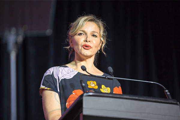 Awards dinner MC talking on stage 