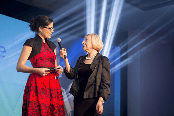 Image of award winner on stage 