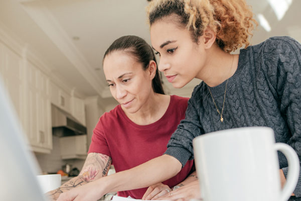 Two females looking at screen