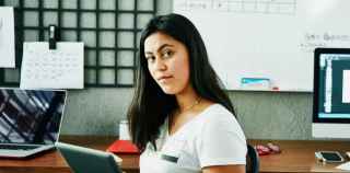 Young woman using an iPad in the office