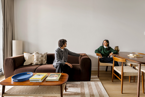 An image of two people in a living room