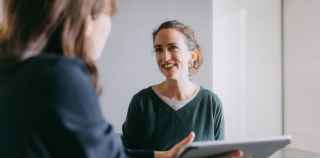 Image of two women talking about financial advice