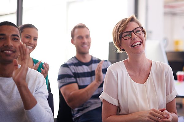 Image of audience members clapping