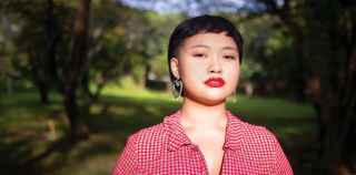 Image of a young asian woman in a red shirt